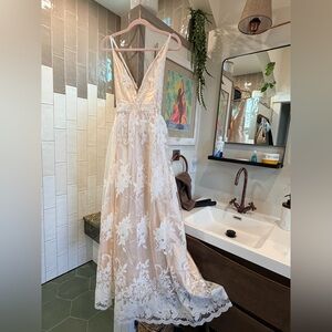 Elegant Lace Gown with Floral Details